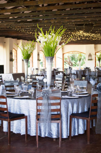 Wedding reception hall with gorgeous flower bouquets